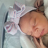 Chioma joined the competition — help win amazing prizes! newborn, baby, sleeping, blanket, bow, hat, face, hand, hospital, bassinet, cozy, soft, pastel, infant, cute, peaceful, resting, child, portrait, closeup