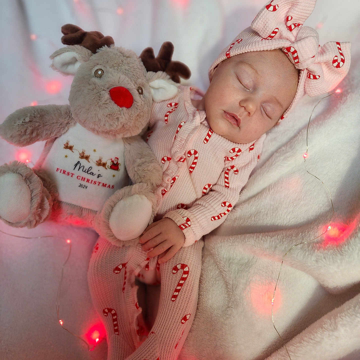 Mila is registered to the contest to win money with this photo: baby, blanket, bodypart, bonnet, clothing, doll, face, finger, furniture, glove, hand, hat, head, newborn, person, photography, portrait, sleeping, teddybear, toy