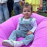 Wren joined the competition — help win amazing prizes! toddler, child, pink_inflatable, overalls, white_shirt, sneakers, outdoor, grass, adults, people, jeans, yellow_dress, drink, phone, bracelet, curly_hair, face, garden, casual_clothing, summer