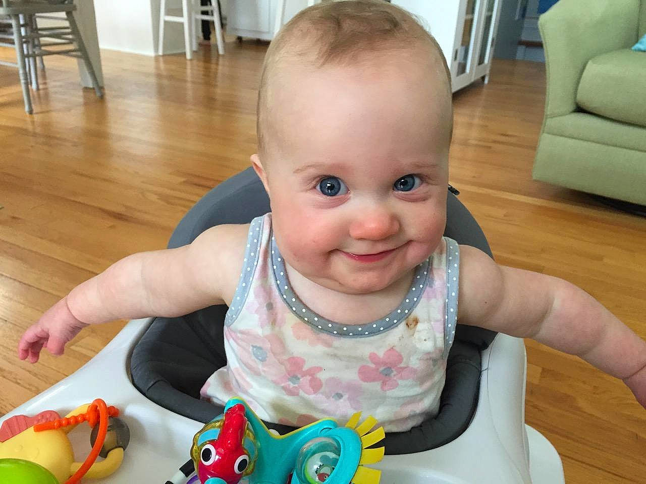 Brinley joined the competition — help win amazing prizes! baby, cheek, child, ear, eating, eye, face, facial_expression, finger, head, iris, joy, mouth, person, play, sitting, skin, smile, toddler, tummy_time