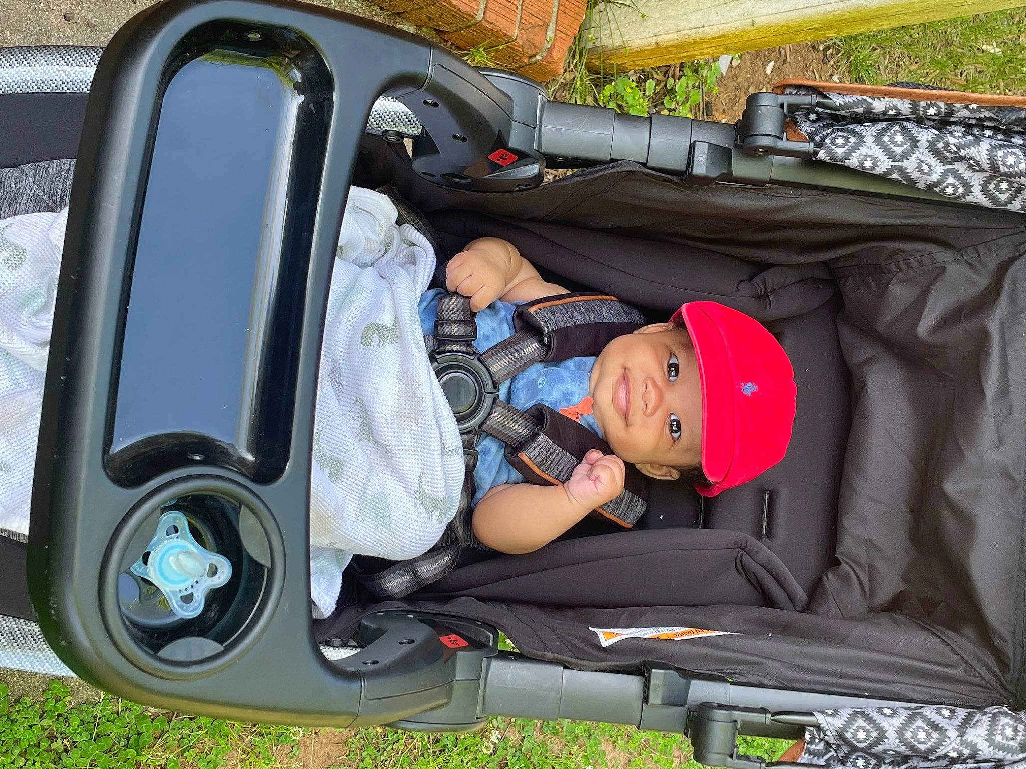 Izaiah is registered to the contest to win money with this photo: auto_part, automotive_design, automotive_exterior, automotive_tire, automotive_wheel_system, bumper, car, car_seat, fender, headwear, joy, mode_of_transport, motor_vehicle, person, plant, product, sneakers, tire, toddler, vehicle