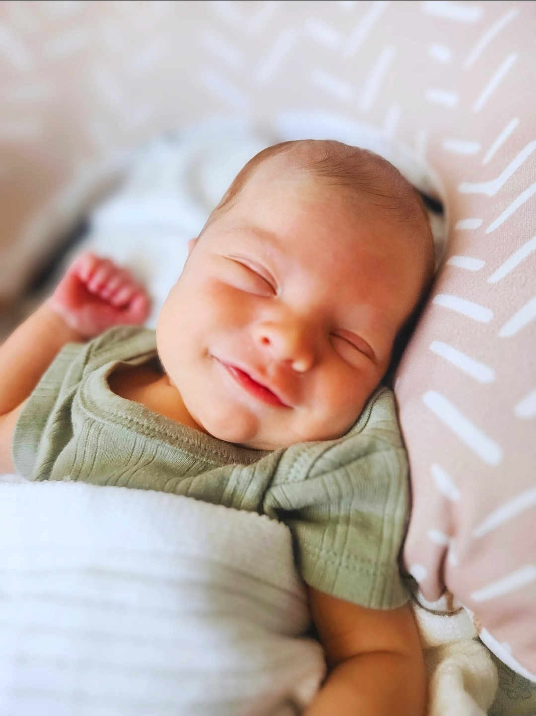 Grayson-Connor is registered to the contest to win money with this photo: baby, sleeping, smile, blanket, pillow, infant, rest, peaceful, child, cute, soft, face, clothing, closeup, newborn, portrait, comfort, relaxation, indoors, happy