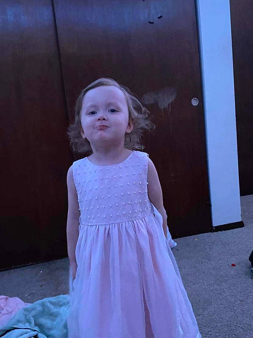 Ivory is registered to the contest to win money with this photo: baby_toddler_clothing, bridal_accessory, bridal_party_dress, day_dress, dress, electric_blue, embellishment, fashion_design, formal_wear, gown, happy, human_body, magenta, one_piece_garment, pattern, person, shoulder, sleeve, toddler, trunk