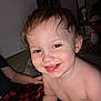 Uhtred is registered to the contest to win money with this photo: toddler, child, smiling, happy, shirtless, indoor, couch, blanket, red, black, checkered, face, messy, hair, eyes, person, portrait, baby, cute, cozy