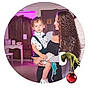 Cameron is registered to the contest to win money with this photo: woman, child, curly_hair, indoor, purple_lighting, holding, affection, young_child, casual_clothing, furniture, cabinet, chair, floor, decor, holiday, christmas_ornament, green_hand, playful, portrait, family