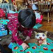 Cameron is registered to the contest to win money with this photo: carpet, cat_face, celebration, chair, child, christmas, christmas_tree, digital_art, funny, gift_wrapping, green_wrapping_paper, holiday_decor, holiday_spirit, indoors, living_room, pajamas, presents, red_clothing, toys, wood_floor