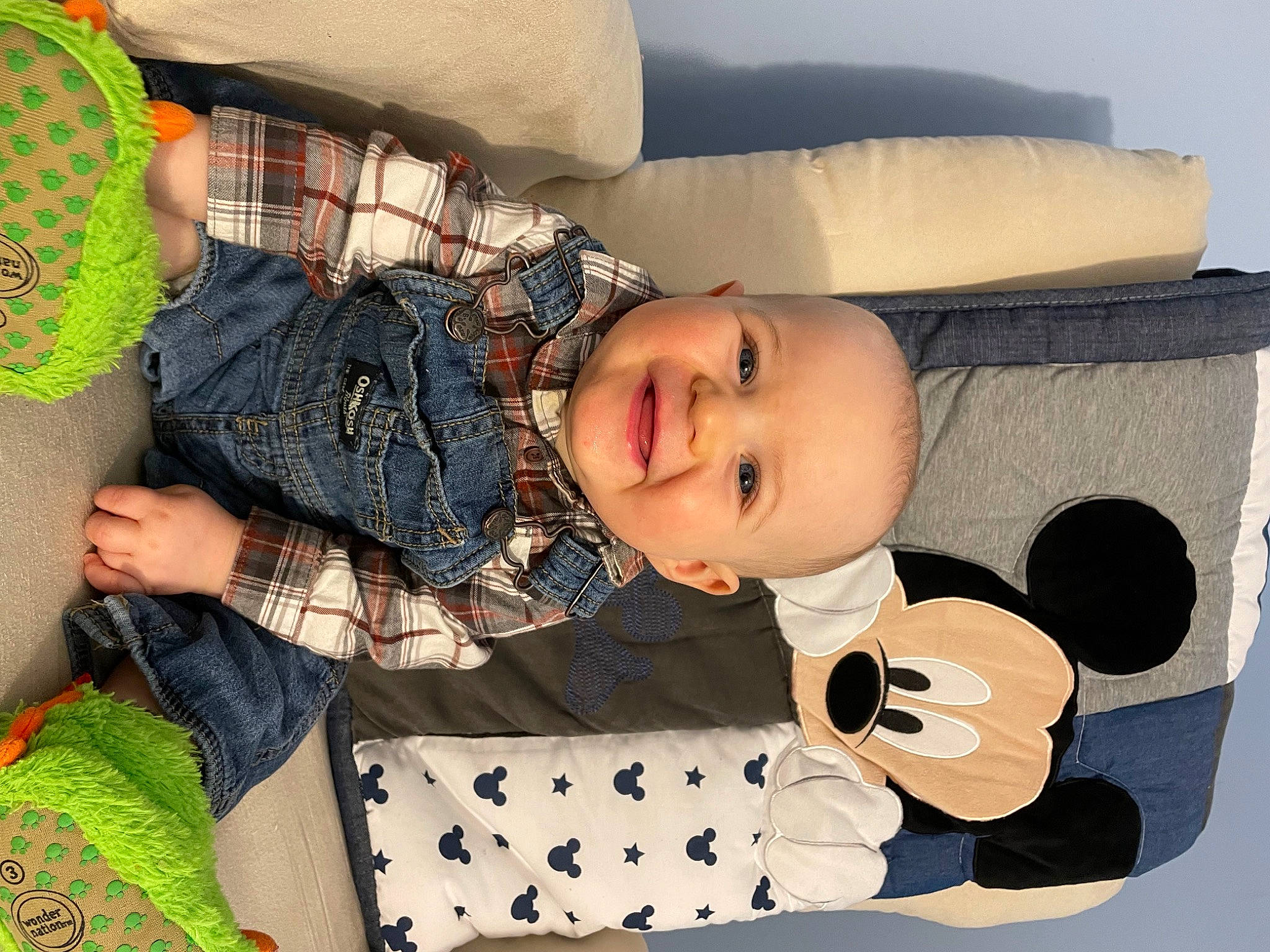 Jeremy is registered to the contest to win money with this photo: baby, baby_products, baby_toddler_clothing, child, comfort, happy, joy, linens, mammal, pattern, person, plaid, product, sitting, sleeve, smile, textile, thigh, toddler, white