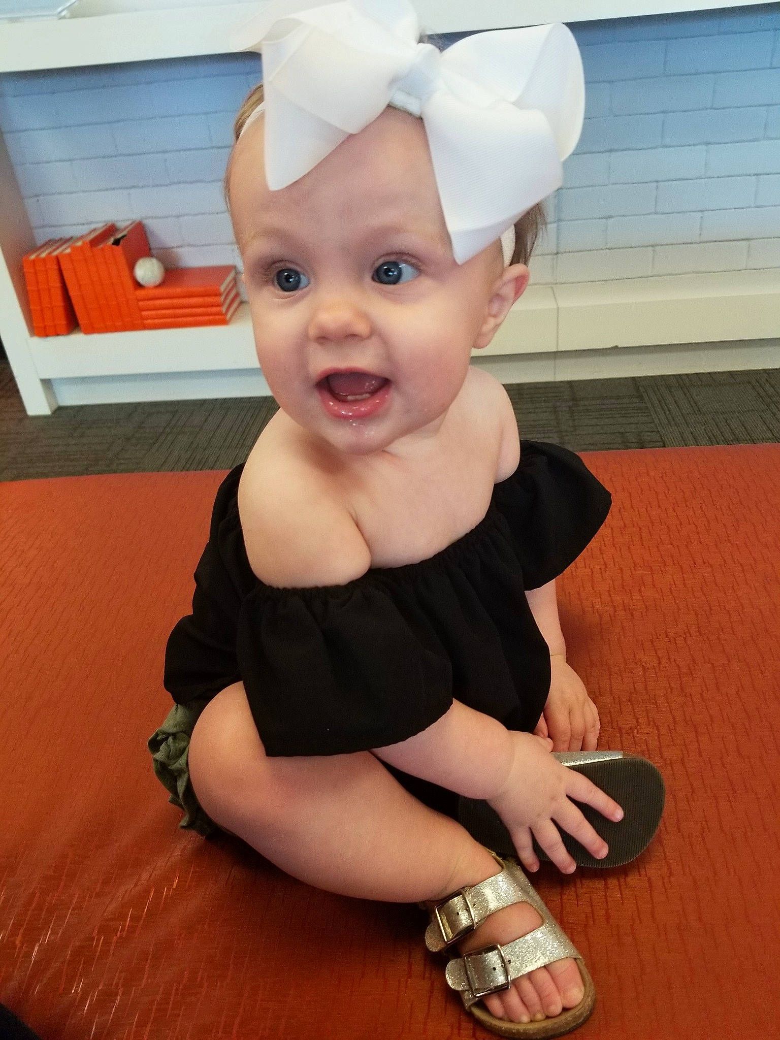 Lynlee joined the competition — help win amazing prizes! arm, baby, baby_toddler_clothing, child, head, headband, headgear, person, shoe, smile, surprise, toddler