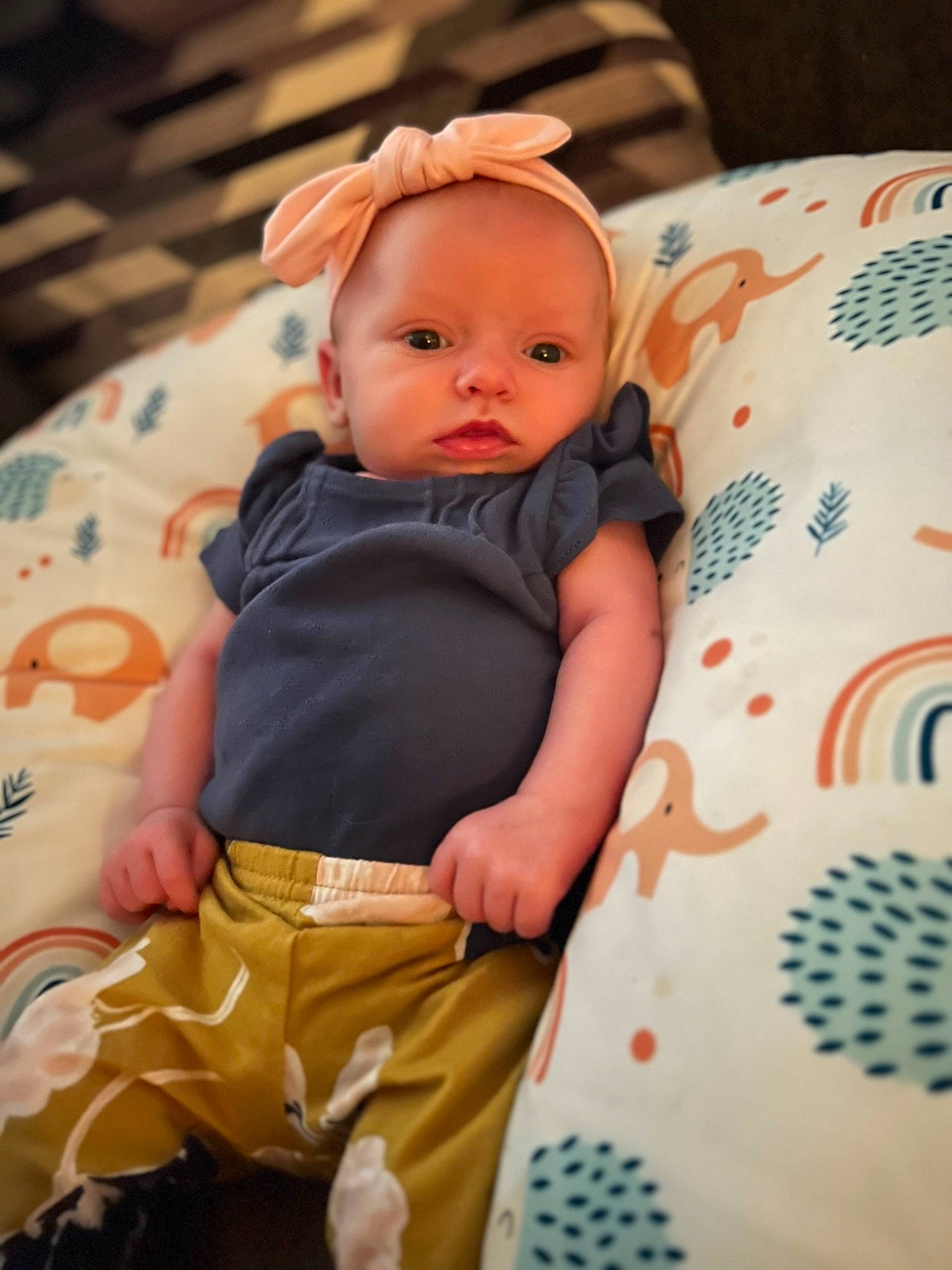 Amaya is registered to the contest to win money with this photo: baby, baby_toddler_clothing, cheek, child, comfort, happy, head, linens, pattern, peach, person, portrait_photography, product, room, sitting, skin, sleeve, t_shirt, textile, toddler