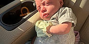 Raymond joined the competition — help win amazing prizes! baby, infant, car_seat, socks, mittens, sunlight, car_interior, seat, clothing, person, cute, newborn, expression, seatbelt, travel, child, portrait, skin, head, resting