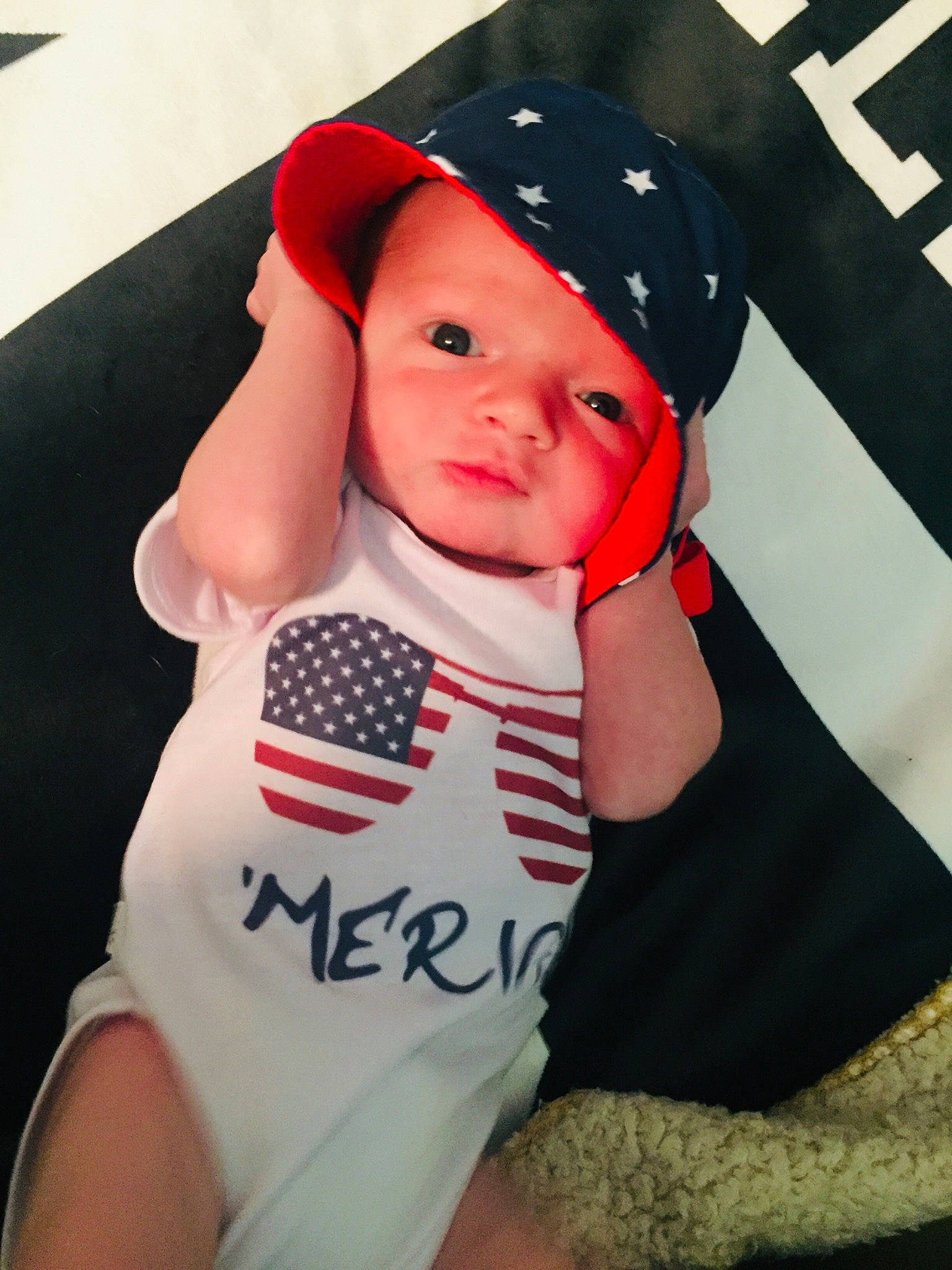 Dallas is registered to the contest to win money with this photo: baby, baby_products, baby_toddler_clothing, child, cool, fashion_accessory, hat, headgear, person, product, sun_hat, t_shirt, toddler