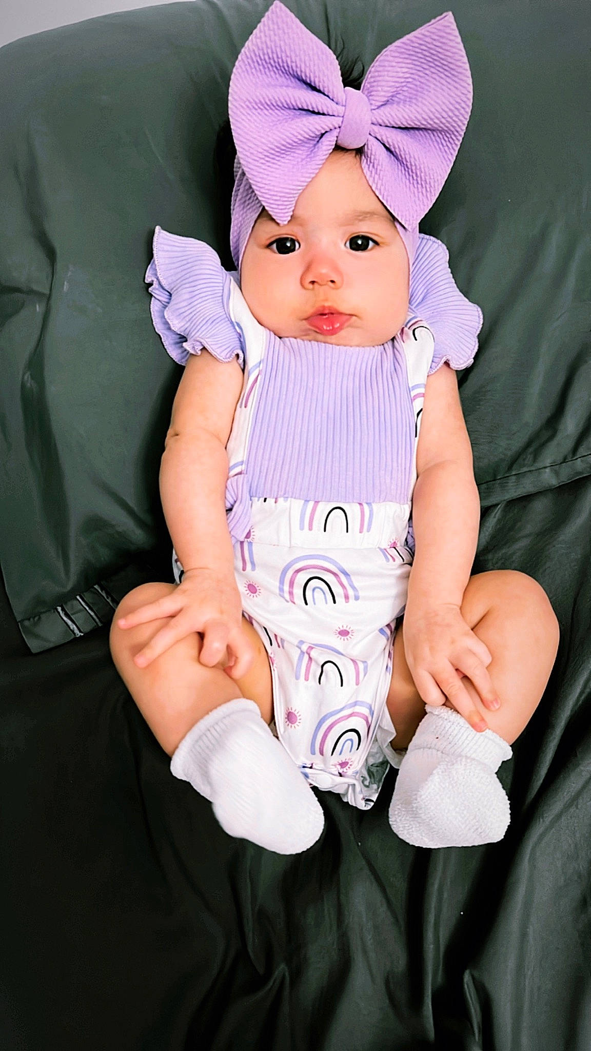Faith is registered to the contest to win money with this photo: baby, baby_toddler_clothing, cap, child, comfort, costume_hat, eye, face, finger, gesture, hand, head, headwear, person, pink, purple, skin, sleeve, thumb, toddler