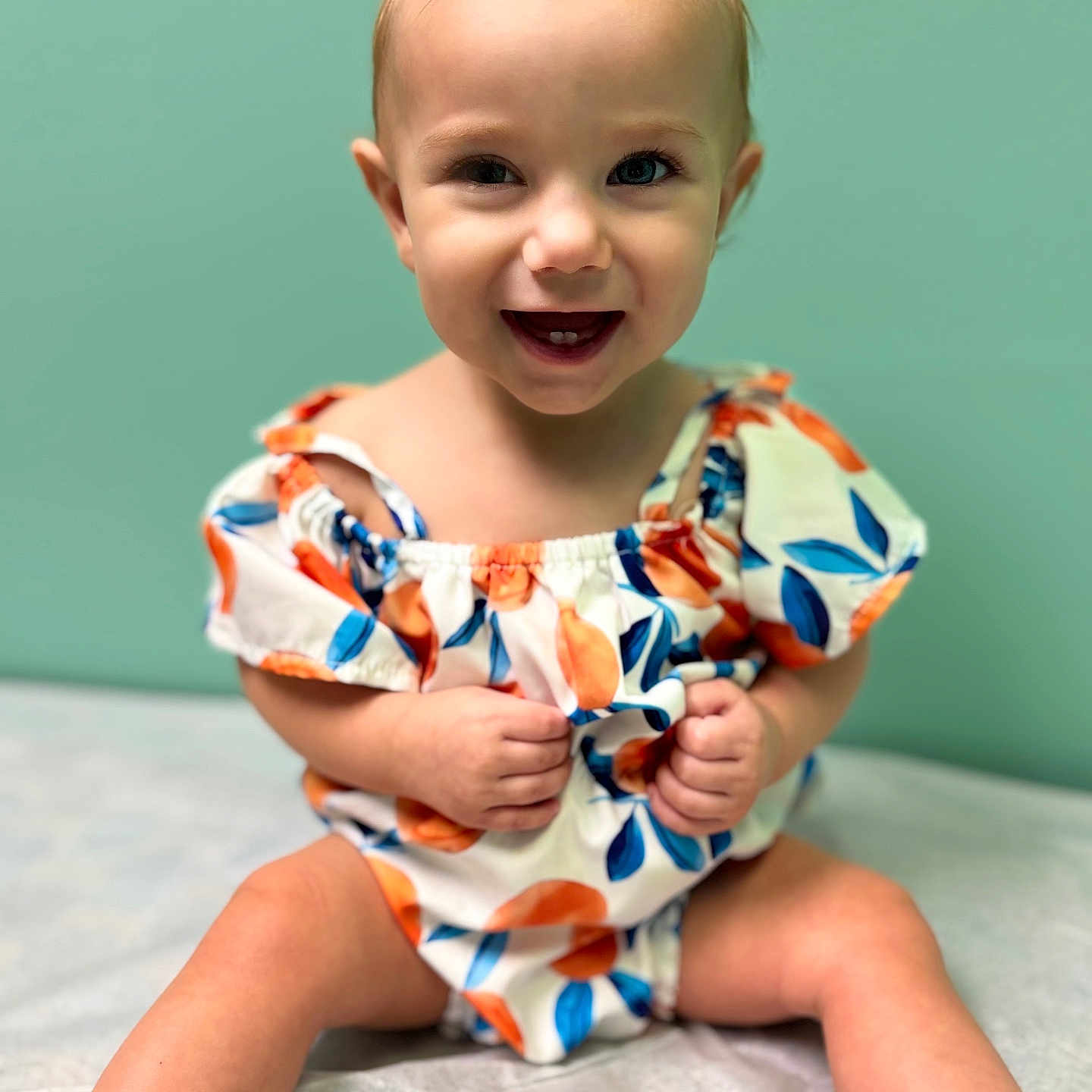 Ember is registered to the contest to win money with this photo: baby, babylaughing, clothing, dress, face, happy, head, laughing, person, photography, portrait, sitting, smile