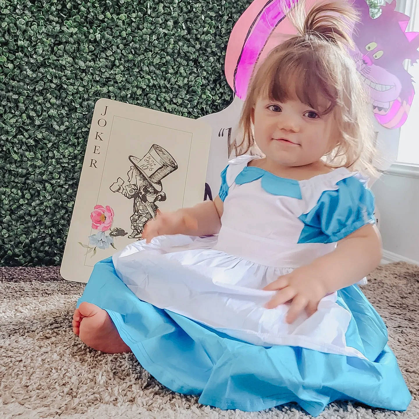 Salem is registered to the contest to win money with this photo: aqua, baby_toddler_clothing, child, costume_hat, day_dress, dress, electric_blue, event, fashion_accessory, fun, happy, headpiece, magenta, party_hat, party_supply, pattern, person, pink, purple, sitting