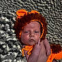 baby, infant, knitted_costume, lion, hat, orange, brown, blanket, texture, cute, sleepy, face, hand, expression, portrait, resting, newborn, soft, warm, cozy