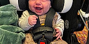 Eris joined the competition — help win amazing prizes! baby, smile, infant, car_seat, black_beanie, cast, blanket, winnie_the_pooh, pajamas, straps, harness, happy, child, seatbelt, footwear, indoors, person, cute, protection, toddler