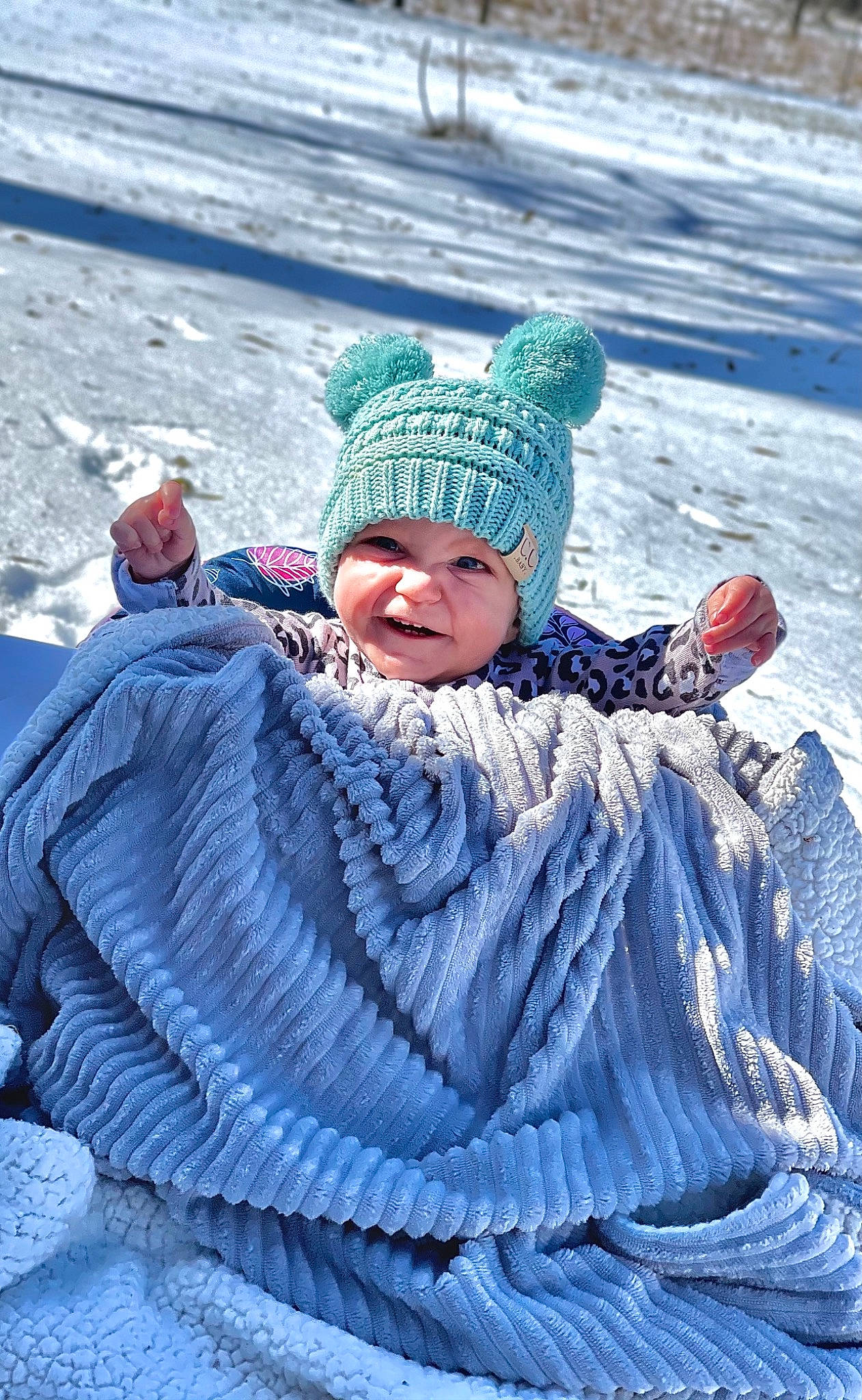 Orianna joined the competition — help win amazing prizes! baby, cap, child, electric_blue, freezing, frost, fun, geological_phenomenon, grass, happy, headwear, knit_cap, landscape, leisure, morning, person, recreation, slope, smile, snow