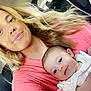 Kyra joined the competition — help win amazing prizes! baby, blonde_hair, candid, car_interior, casual, child, closeup, daylight, family, happy, holding, infant, parent, person, pink_shirt, portrait, seat, seatbelt, smiling, woman