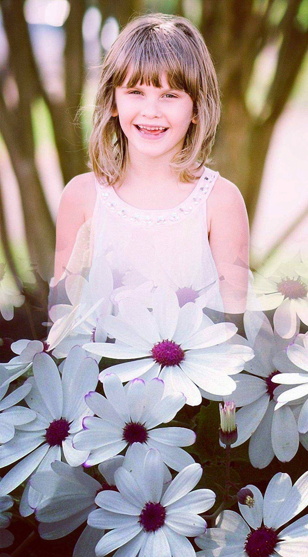 Alayna is registered to the contest to win money with this photo: annual_plant, bangs, beauty, blossom, child_model, dress, embellishment, facial_expression, flower, flowering_plant, happy, hime_cut, joy, pedicel, perennial_plant, person, petal, pink, portrait_photography, spring