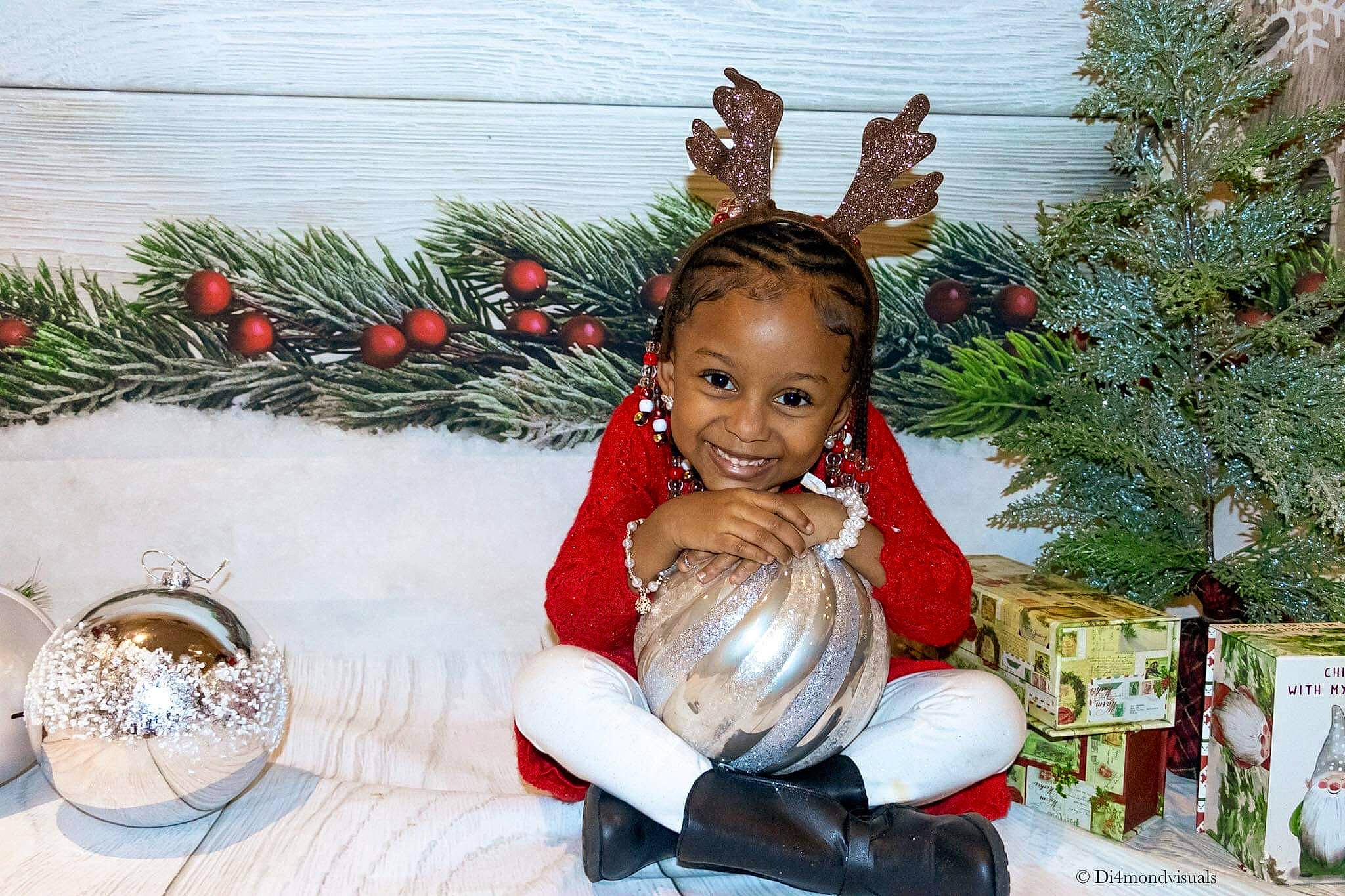 Elaina is registered to the contest to win money with this photo: christmas, christmas_decoration, christmas_eve, christmas_ornament, christmas_tree, conifer, event, evergreen, happy, holiday, holiday_ornament, joy, ornament, person, plant, santa_claus, smile, toddler, tradition, tree