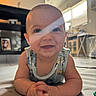 Darell joined the competition — help win amazing prizes! baby, infant, child, smiling, portrait, indoor, living_room, play_mat, sitting, crawling, onesie, blue_eyes, face, hands, arms, sunlight, window, shelves, home, happy