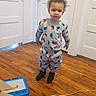 Ja'Vonte joined the competition — help win amazing prizes! toddler, child, pajamas, sesame_street, elmo, cookie_monster, indoor, wooden_floor, white_doors, drawing_board, toy, curly_hair, standing, person, clothing, floor, room, home, casual, footwear