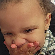 Ja'Vonte joined the competition — help win amazing prizes! child, toddler, face, hand, plaid_shirt, expression, funny_face, closeup, person, skin, hair, cute, indoor, portrait, young_child, fingernails, clothing, emotion, gesture, casual