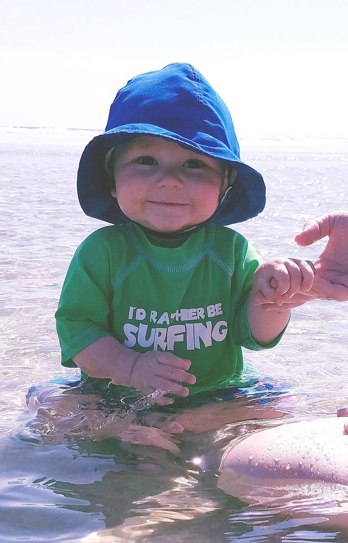 Theo is registered to the contest to win money with this photo: beach, boy, child, fun, headgear, headwear, joy, person, play, recreation, sand, sea, smile, summer, toddler, vacation, vertebrate, water