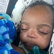 Karter joined the competition — help win amazing prizes! baby, sleeping, pacifier, blanket, car_seat, child, face, eyelashes, curly_hair, close_up, infant, resting, comfort, soft_texture, peaceful, indoors, cute, newborn, wrapped, relaxed