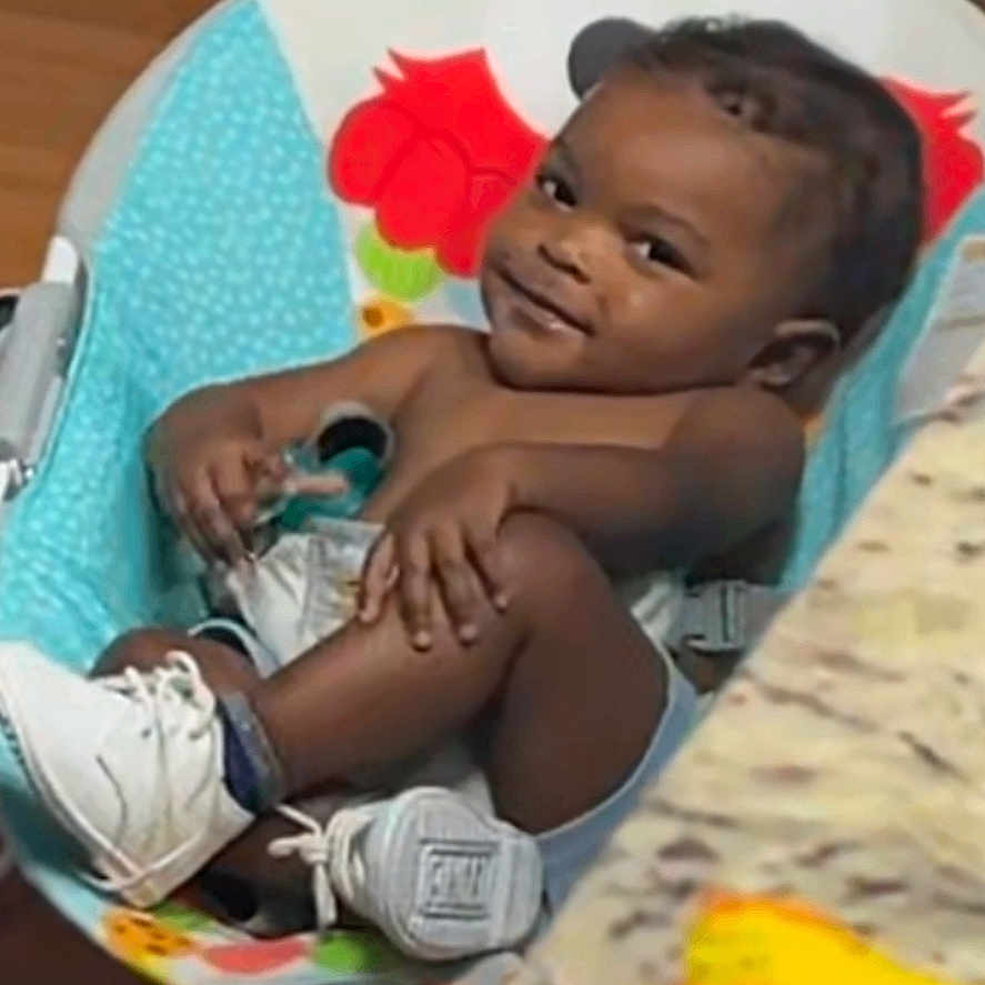 Kelvin joined the competition — help win amazing prizes! baby, baby_seat, child, clothing, colorful, cute, floor, footwear, furniture, happy, home, indoor, infant, person, relaxed, seat, smiling, sneakers, toy, wooden_floor