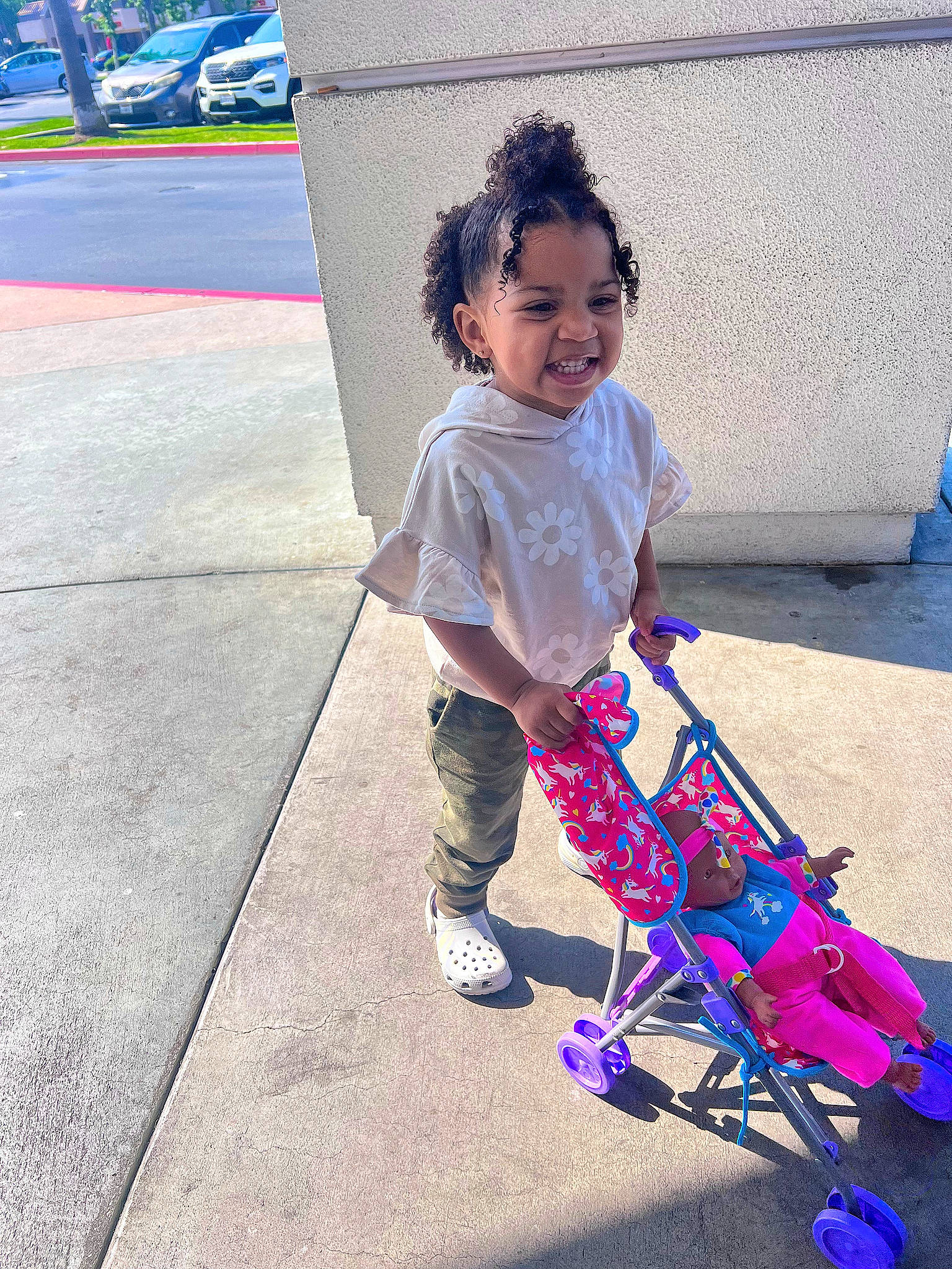Sienna joined the competition — help win amazing prizes! asphalt, baby, baby_carriage, baby_toddler_clothing, blue, child, eye, happy, leisure, magenta, person, pink, purple, recreation, road_surface, smile, tints_and_shades, tire, toddler, travel