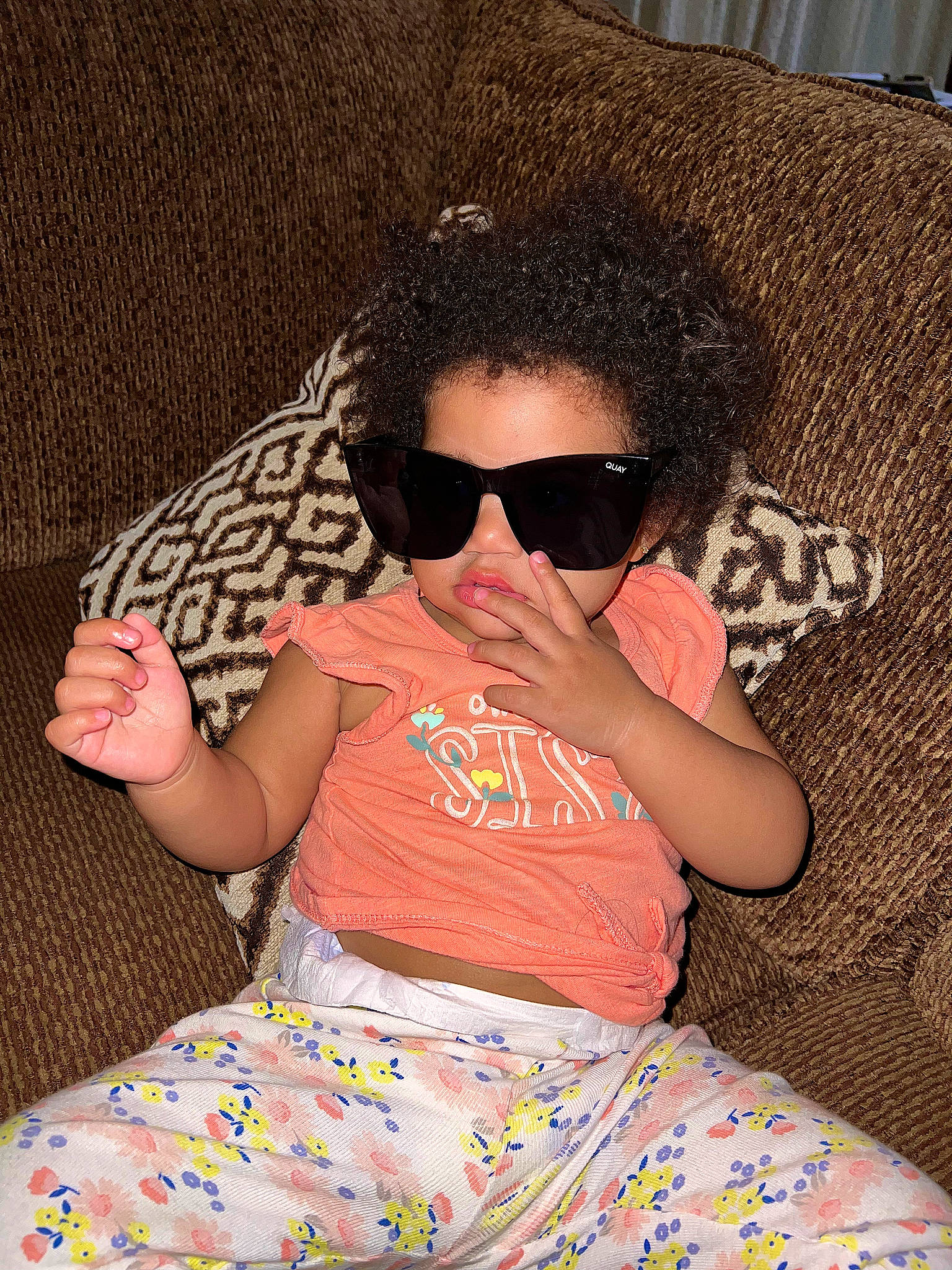 Sienna is registered to the contest to win money with this photo: arm, baby_toddler_clothing, cap, child, comfort, cool, eyewear, fashion, fun, glasses, goggles, hairstyle, happy, leisure, person, sleeve, sunglasses, t_shirt, textile, thigh