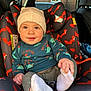 Enzo joined the competition — help win amazing prizes! baby, child, car_seat, hat, beige_hat, sweater, car_interior, fox_pattern, seatbelt, footwear, white_socks, smiling, cute, infant, window, vehicle, seat, holding_foot, playful, portrait