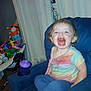 Stormie joined the competition — help win amazing prizes! toddler, child, smiling, sitting, chair, colorful_clothing, indoor, toy, sippy_cup, curtain, carpet, happy, person, foot, hair, face, mouth_open, furniture, room, leggings