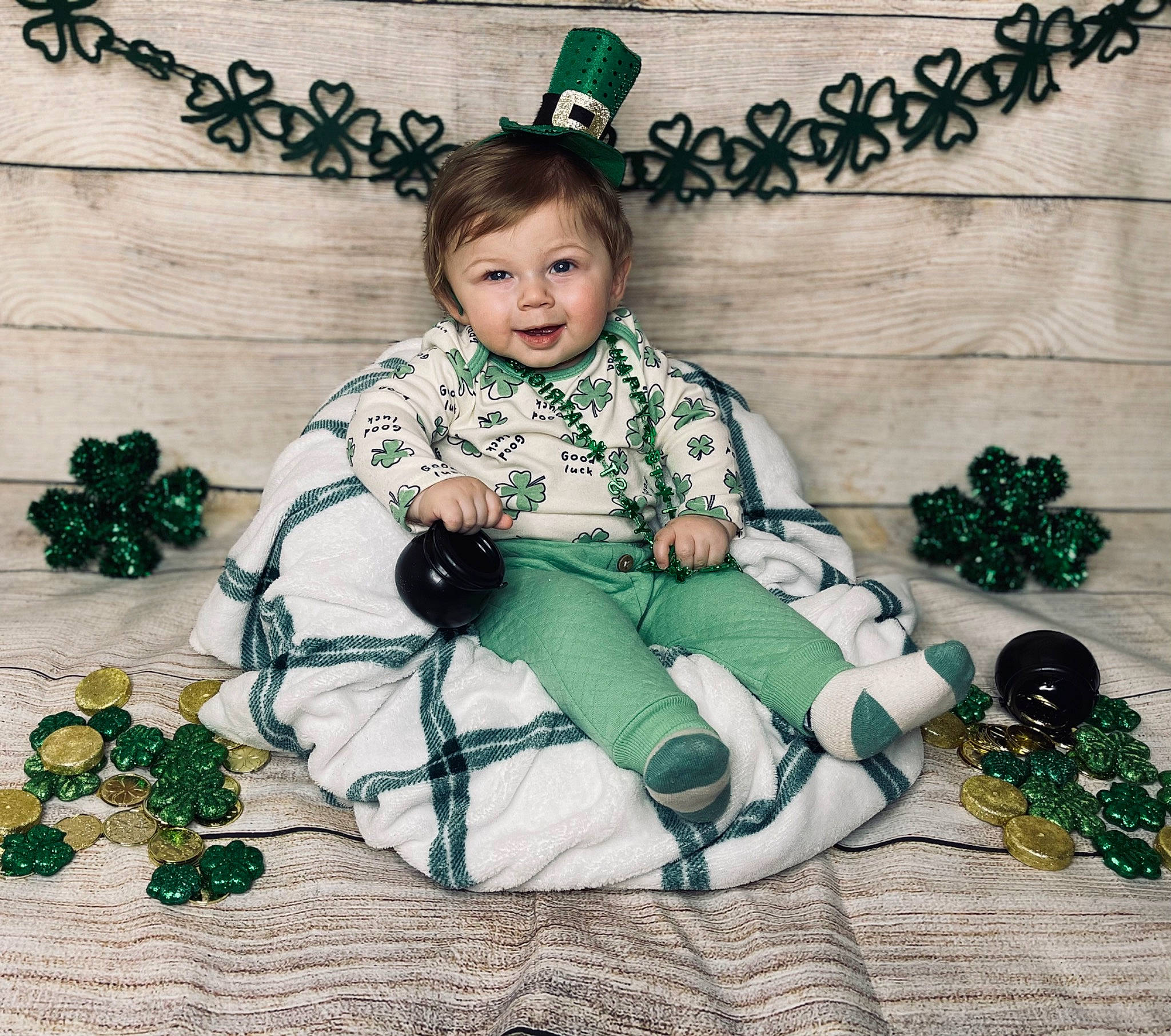 Jace joined the competition — help win amazing prizes! baby_toddler_clothing, child, christmas, christmas_decoration, fashion_accessory, font, green, happy, head, holiday, jewellery, lap, ornament, outerwear, pattern, person, plaid, sitting, sleeve, sock