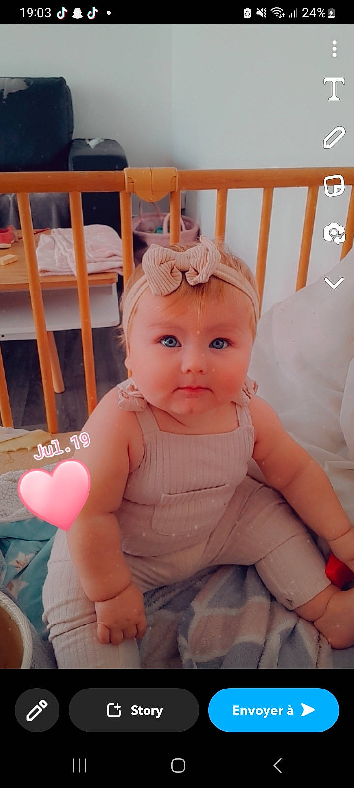 Leana participe au concours pour gagner de l'argent avec cette photo : baby, baby_toddler_clothing, cheek, child, comfort, fun, happy, head, headgear, human_leg, lap, person, pink, product, sitting, skin, thigh, thumb, toddler, white