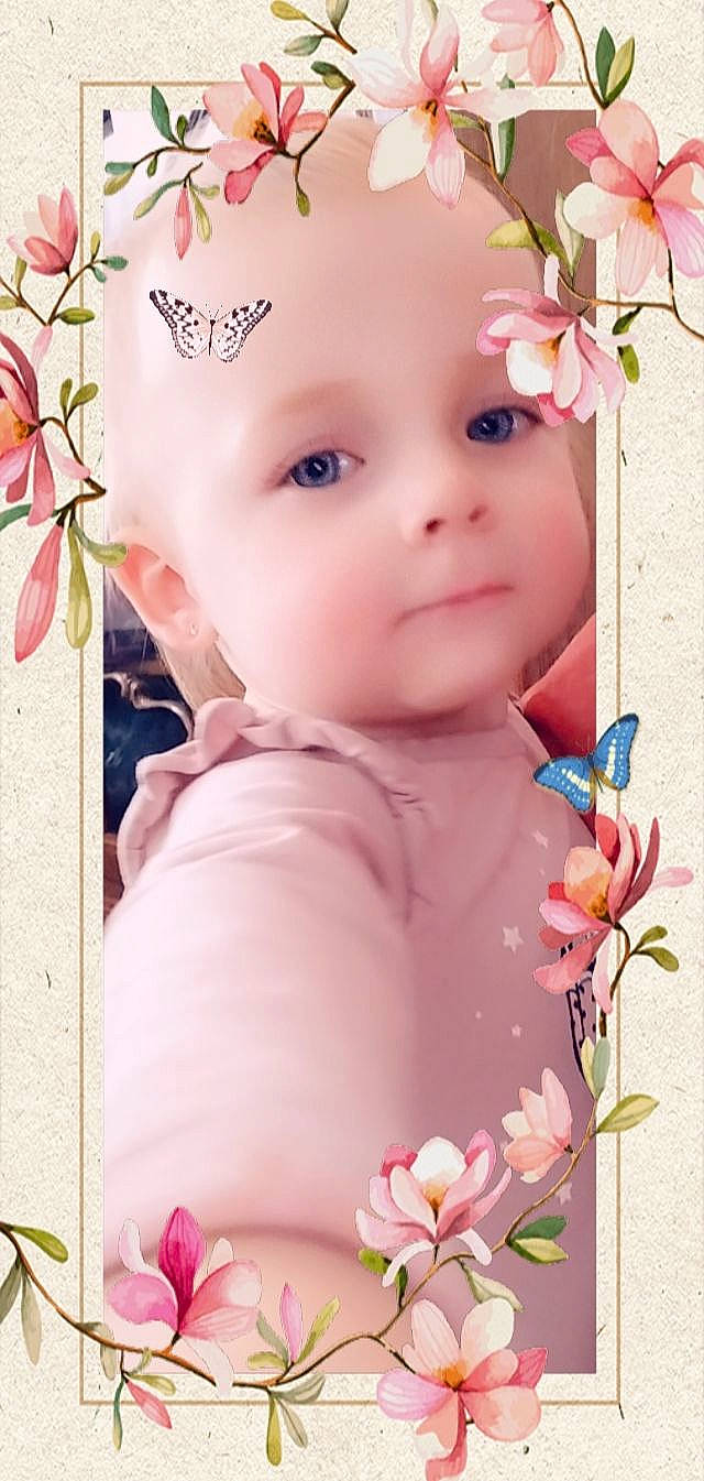 Yllona participe au concours pour gagner de l'argent avec cette photo : baby, baby_toddler_clothing, blossom, cheek, child, eyelash, flower, grass, happy, headwear, magenta, pattern, peach, person, petal, pink, plant, product, skin, spring