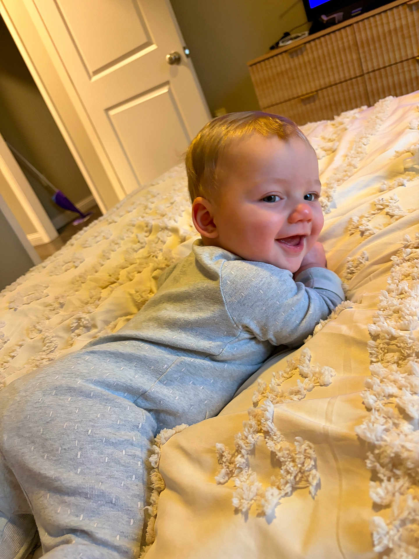 Lux joined the competition — help win amazing prizes! baby, child, smiling, pajamas, bed, blanket, indoors, face, happy, person, infant, cute, lying_down, home, texture, soft, sleepwear, portrait, young, cozy