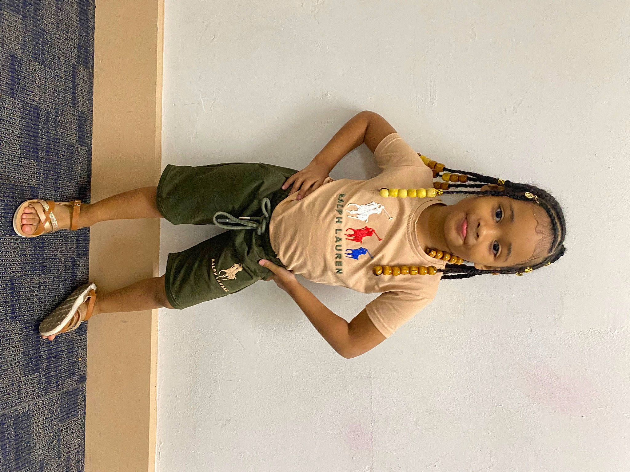 Jai is registered to the contest to win money with this photo: arm, dress, elbow, fashion_design, finger, human_leg, joint, knee, leg, person, room, shorts, sitting, sleeve, sportswear, t_shirt, thigh, top, uniform, waist