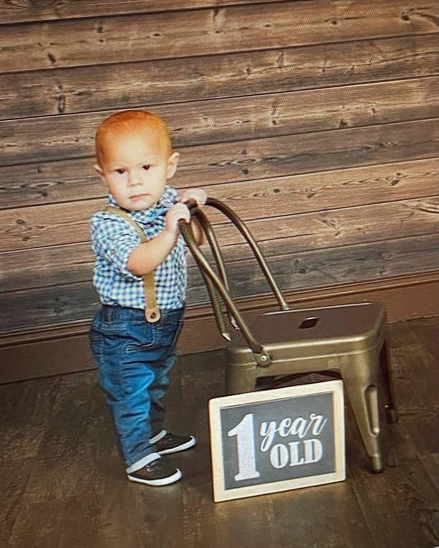 Joziah is registered to the contest to win money with this photo: audio_equipment, bag, baggage, brick, brickwork, child, denim, electric_blue, flooring, font, fun, happy, jeans, metal, person, portrait_photography, sitting, street_fashion, toddler, wall