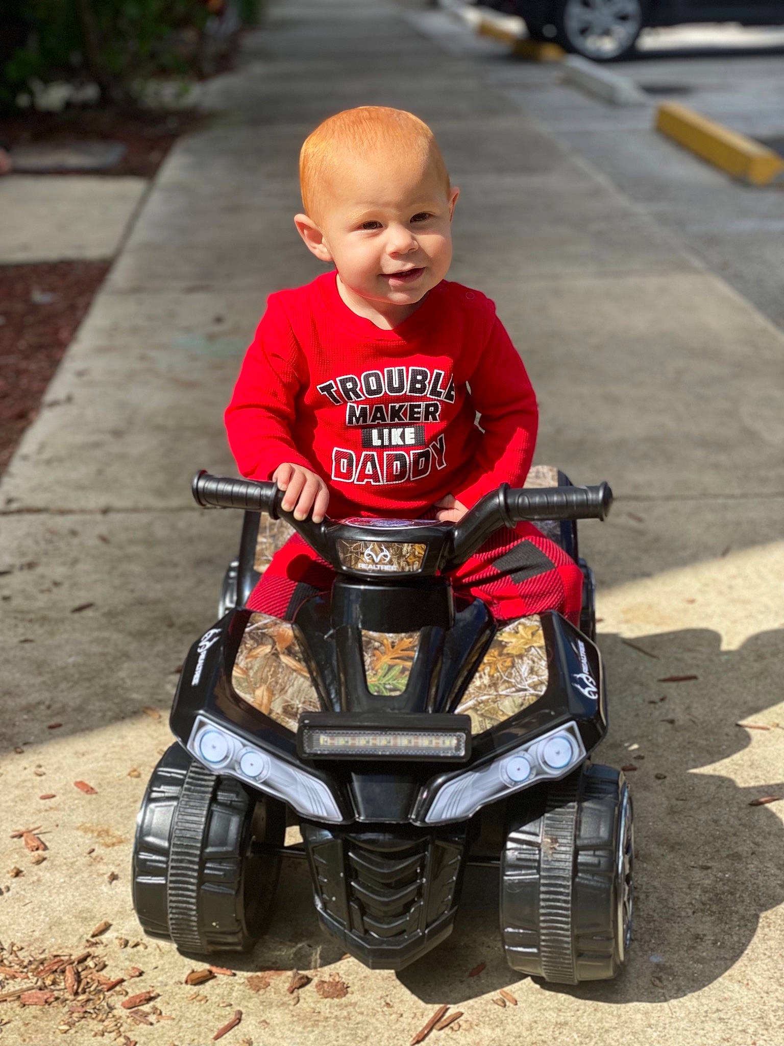 Joziah joined the competition — help win amazing prizes! automotive_design, automotive_exterior, automotive_tire, automotive_wheel_system, bumper, fender, grass, motor_vehicle, motorsport, person, racing, recreation, riding_toy, rolling, t_shirt, tire, toddler, toy, tread, vehicle