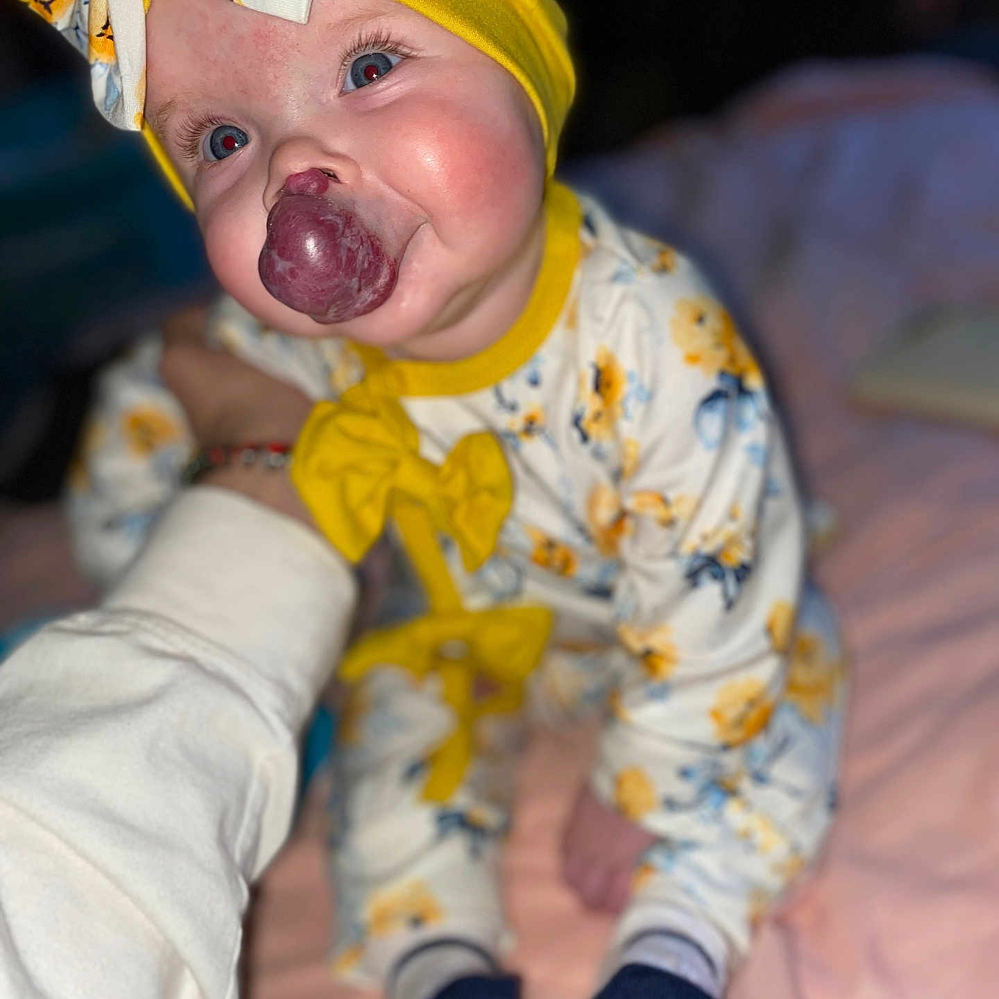 Ella is registered to the contest to win money with this photo: baby, babylaughing, bodypart, bonnet, cap, clothing, costume, face, finger, glove, hand, happy, hat, head, hosiery, mouth, person, photography, portrait, sock