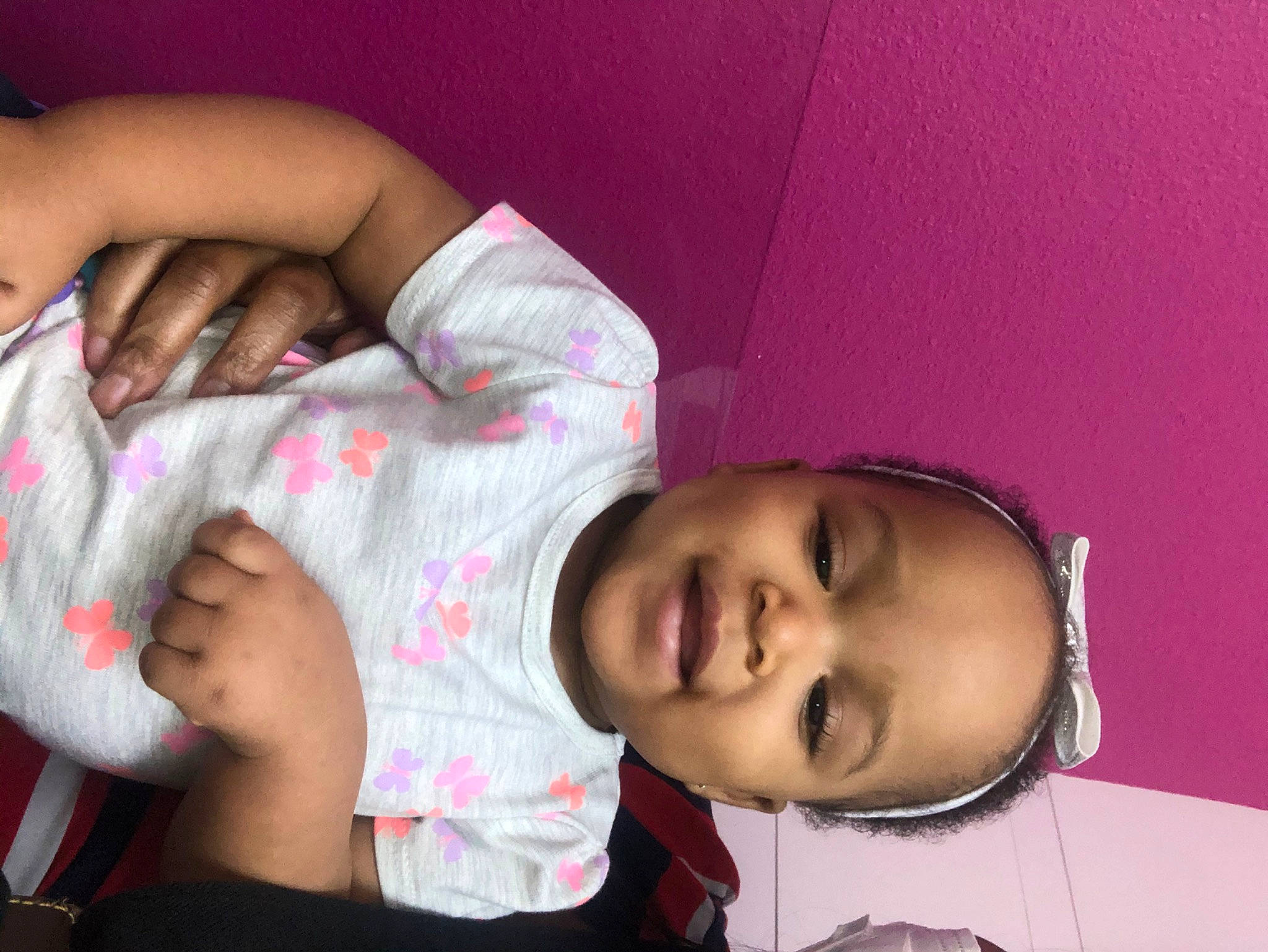 Ava Marie is registered to the contest to win money with this photo: arm, baby, bedtime, cheek, child, finger, hand, mouth, person, pink, skin, smile, toddler