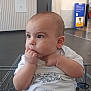 Bryson joined the competition — help win amazing prizes! baby, infant, shopping_cart, walmart, store_interior, child, curious, white_shirt, gaze, hands, seated, retail, shopping, toddler, indoor, person, cute, young_child, face, expression