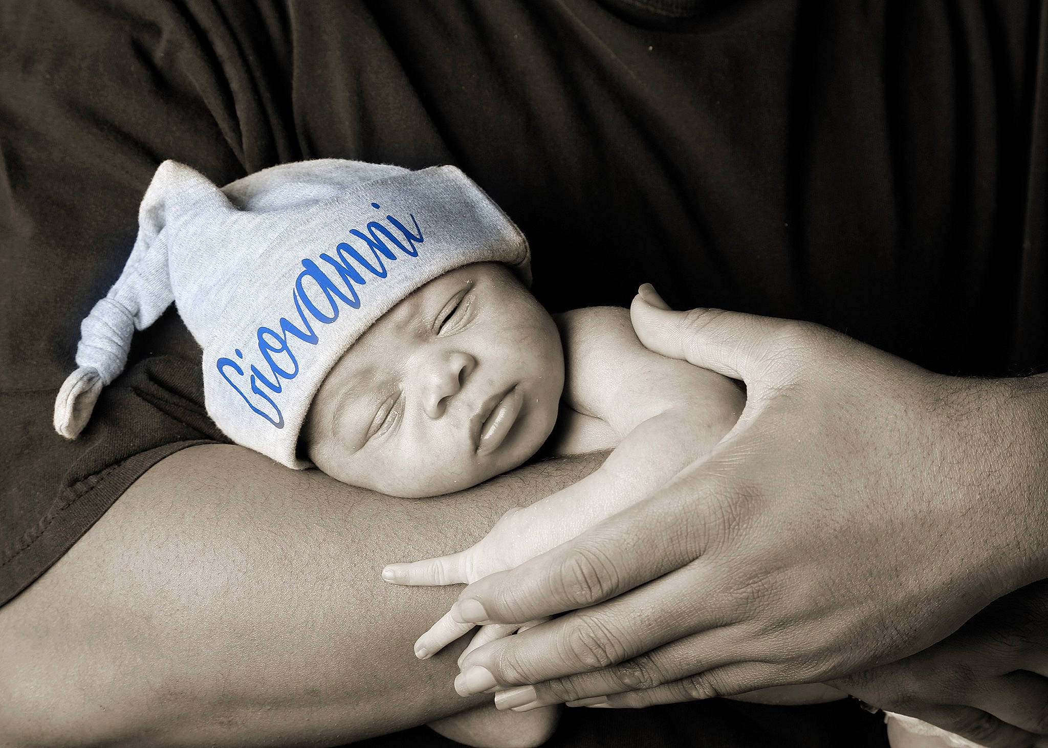 Gio is registered to the contest to win money with this photo: abdomen, baby, chest, child, close_up, comfort, elbow, eye, finger, flash_photography, gesture, glasses, hand, happy, headwear, monochrome_photography, nail, person, skin, toddler