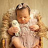 Rose participe au concours pour gagner de l'argent avec cette photo : newborn, baby, sleeping, wicker_basket, plush_toy, headband, bow, lace_dress, tulle, curly_wool, cozy, peaceful, infant, soft_lighting, portrait, hands, feet, wooden_floor, cute, adorable