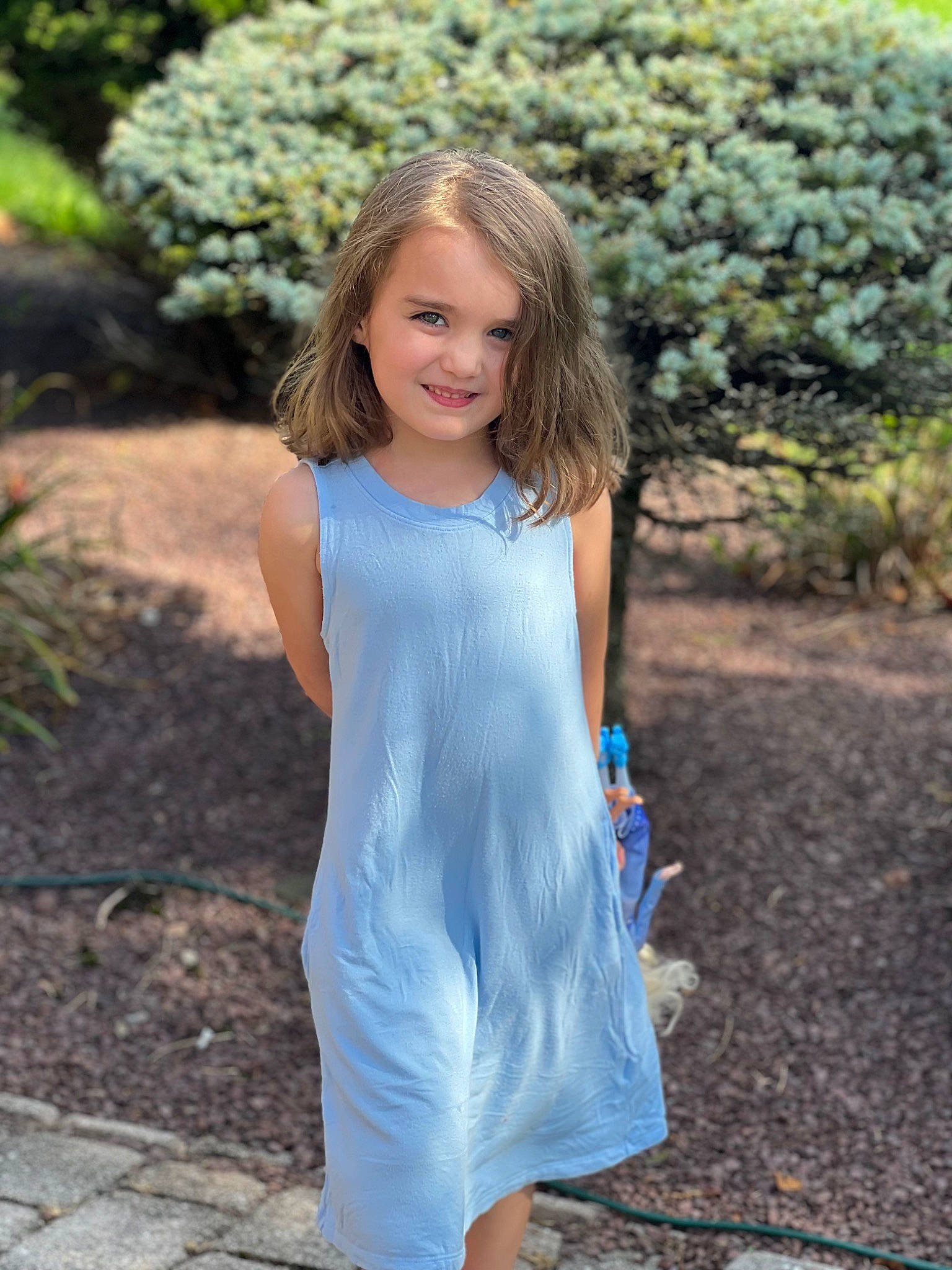 Gabriella is registered to the contest to win money with this photo: day_dress, denim, dress, electric_blue, formal_wear, grass, hair, happy, joy, leisure, long_hair, neck, one_piece_garment, people_in_nature, person, plant, sleeve, summer, t_shirt, tree