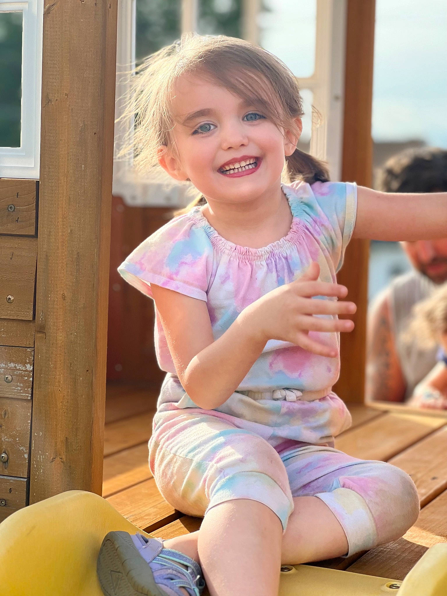 Gabriella is registered to the contest to win money with this photo: baby_toddler_clothing, beauty, blond, child, finger, fun, happy, human_leg, joy, knee, leg, leisure, person, shorts, shoulder, sitting, skin, smile, summer, thigh