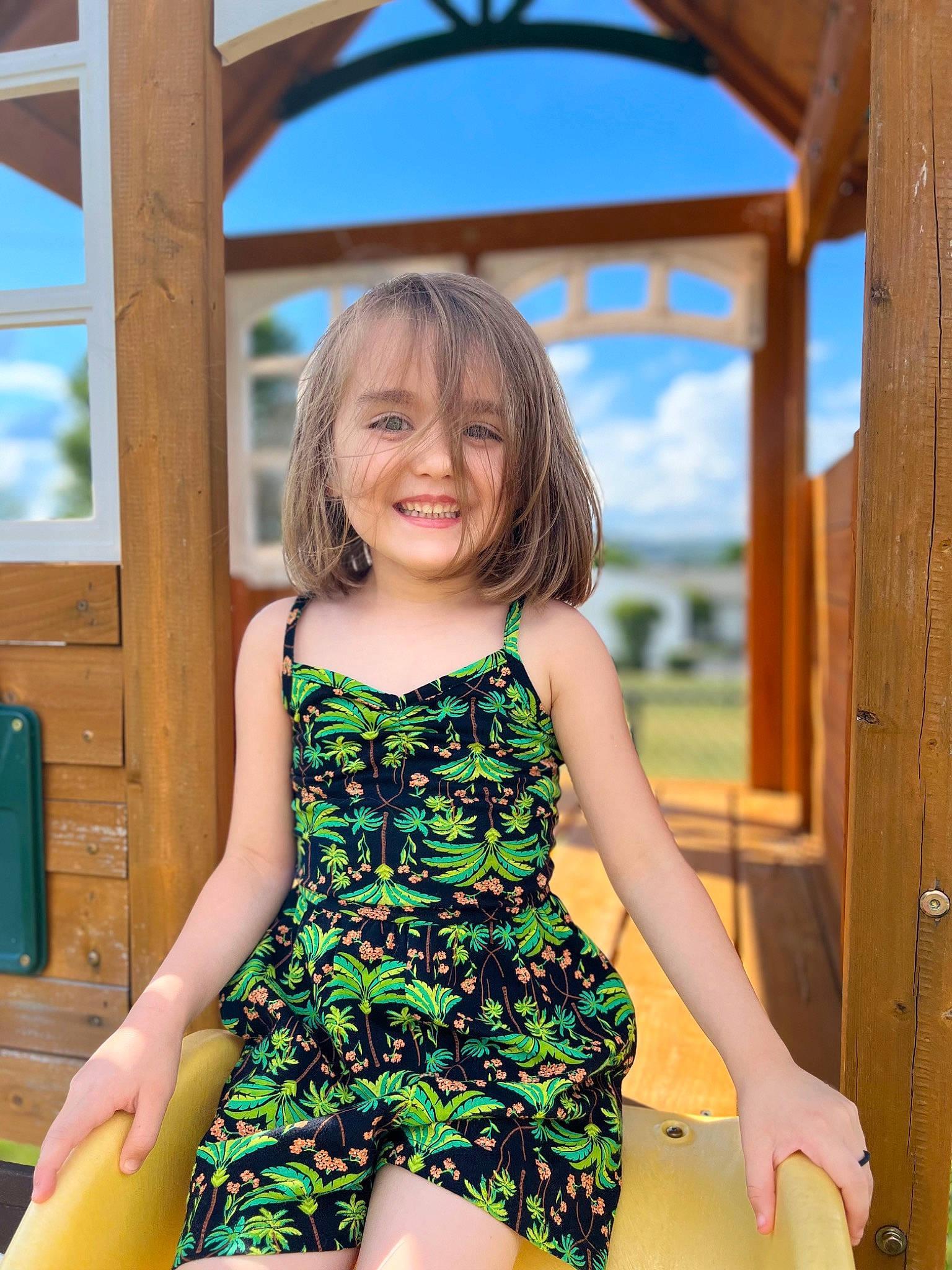 Gabriella is registered to the contest to win money with this photo: blond, brown_hair, child, day_dress, electric_blue, flash_photography, fun, grass, happy, human_leg, joy, leisure, one_piece_garment, person, photograph, sky, sleeve, smile, summer, thigh