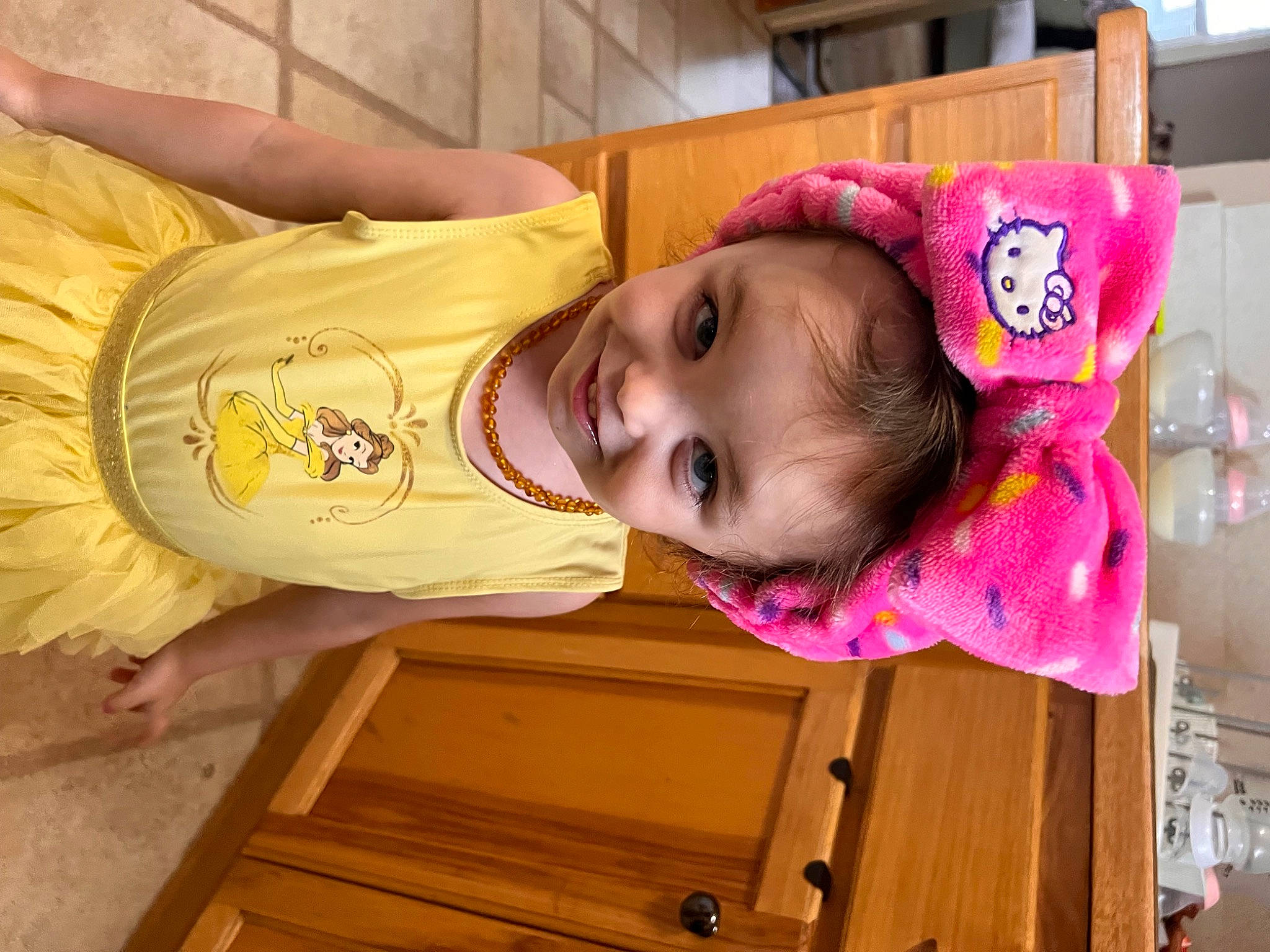 Evangelina is registered to the contest to win money with this photo: baby, baby_products, baby_safety, baby_toddler_clothing, child, facial_expression, fun, happy, hardwood, hat, joy, magenta, nose, pattern, person, pink, room, skin, smile, toddler